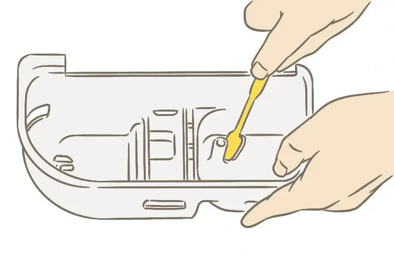 洗濯機の掃除 洗剤ケースを洗う様子
